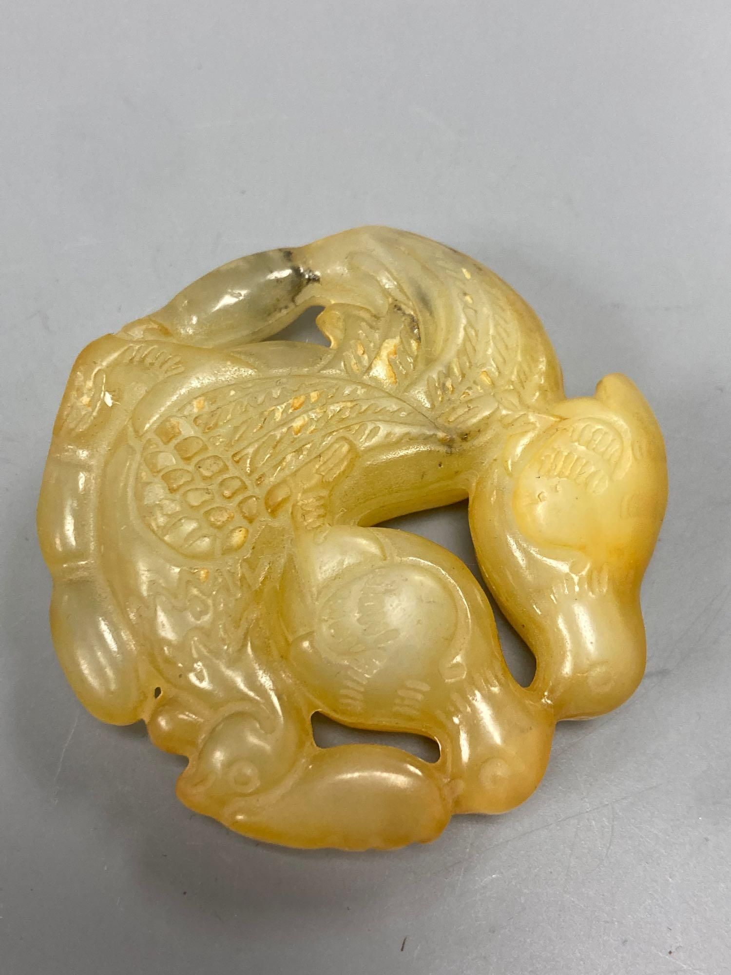 A group of four Chinese jade and hardstone carvings